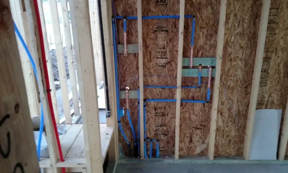 new construction bathroom plumbed wall
